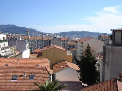 a view of a city with roofs and buildings at Appartement Buenos Aires in Nice