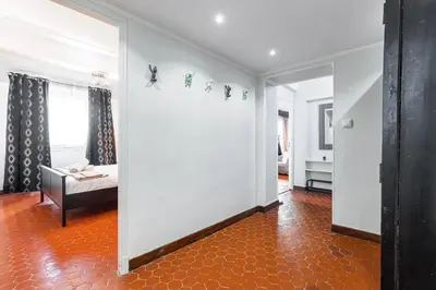 a living room with a bed and a mirror at Large 3 Bdr Old Town - AC in Nice