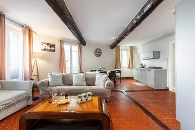 a living room with a couch and a table at Large 3 Bdr Old Town - AC in Nice