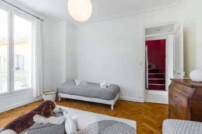 a living room with a teddy bear sitting on a couch at Stylish Art Deco villa near the sea 4 Bdrs Pool and garage in Nice
