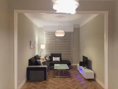 a living room with a couch and a table at NICE 115 BY THE SEA in Nice