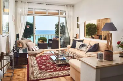 a living room with a view of the ocean at Sunlight Properties - 