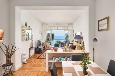 a living room with a view of the ocean at Sunlight Properties - 