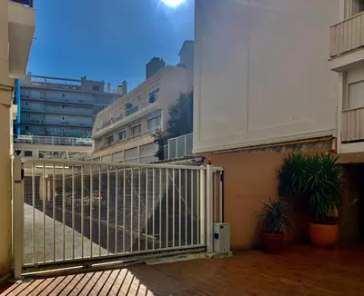 a gate in a building with plants and buildings at Super studio in the heart of Nice! in Nice