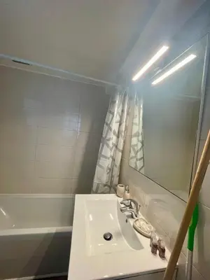 a bathroom with a sink and a bath tub at Super studio in the heart of Nice! in Nice