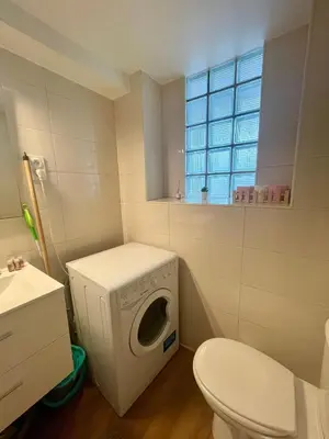 a bathroom with a washing machine and a toilet at Super studio in the heart of Nice! in Nice