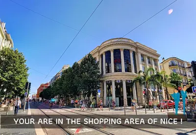 a building with the words your are in the shopping area of nike at Nestor&Jeeves - DUPLEX MIROIR - Hyper center - Shopping area - Top floor in Nice