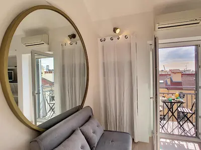 a living room with a mirror and a couch at Nestor&Jeeves - DUPLEX MIROIR - Hyper center - Shopping area - Top floor in Nice