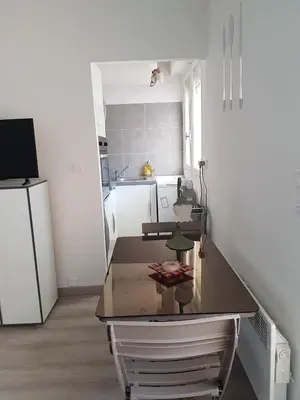 a kitchen with a counter top and a refrigerator at Sci MDM in Nice