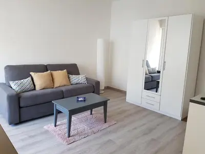 a living room with a couch and a table at Sci MDM in Nice