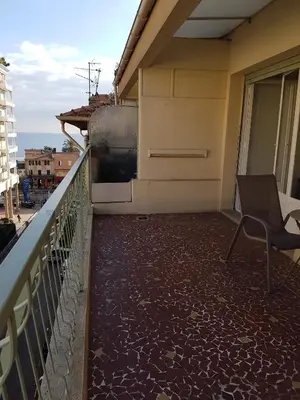 a balcony with a chair on a building at Sci MDM in Nice