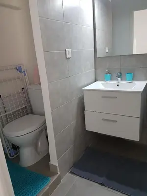 a bathroom with a white sink and a toilet at Sci MDM in Nice