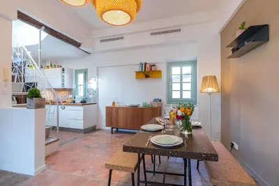 a kitchen and dining room with a table and chairs at Le Château - THE MOST BEAUTIFUL SIGHT IN OLD TOWN, private terrace in Nice