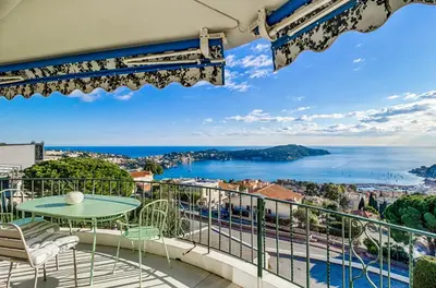 a balcony with a view of the ocean at Luxurious Penthouse with panoramic view in Villefranche-sur-Mer