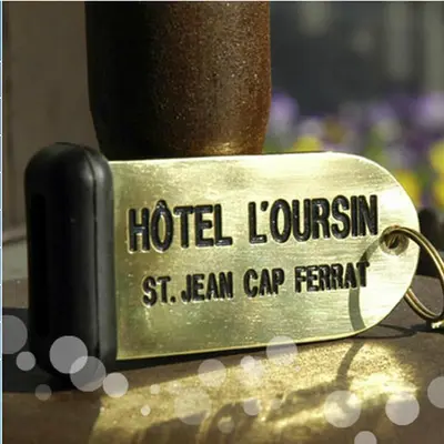a tag that reads hotel louisin st lean cap tent at L'Oursin in Saint-Jean-Cap-Ferrat