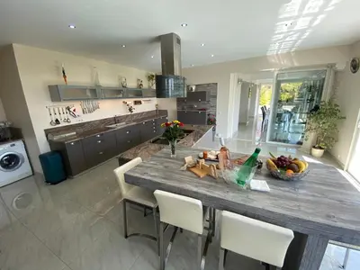 a kitchen with a table with a bowl of fruit on it at Diamond Villa 5 Star - NICE in Nice