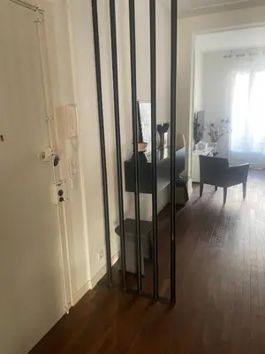 a room with a room with a piano and a mirror at Appartement moderne 4p hypercentre de nice in Nice