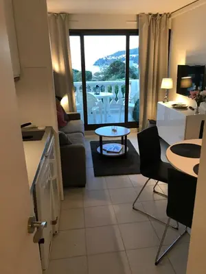 a kitchen and living room with a view of the ocean at Nice/Villefranche in Villefranche-sur-Mer