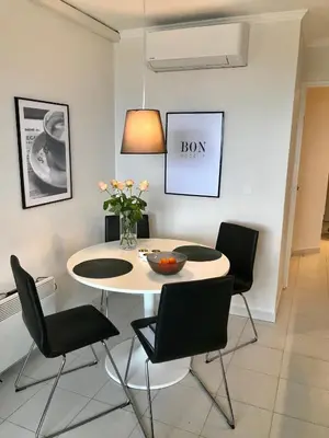 a dining room with a table and chairs at Nice/Villefranche in Villefranche-sur-Mer