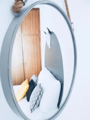 a mirror on a wall with pillows in a room at Nuances d'Azur - Bel Azur in Nice
