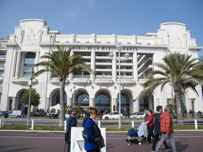 a group of people walking in front of a building at Residence du Palais Nil in Nice