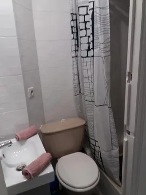 a small bathroom with a toilet and a sink at Nice Centre, Charmant Studio in Nice