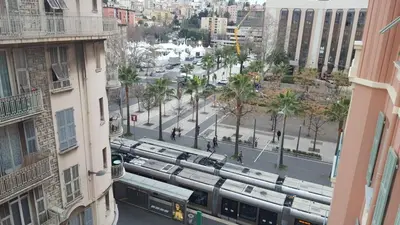 an aerial view of a city street with buses at Nice Centre, Charmant Studio in Nice