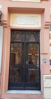 a window of a building with a sign above it at Nice Centre, Charmant Studio in Nice