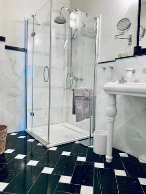 a bathroom with a shower and a sink at Villa Bagatelle - Luxury apartment in Nice