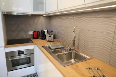 a kitchen with a sink and a stove at la terrasse in Nice