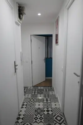 a hallway with a black and white tile floor at la terrasse in Nice