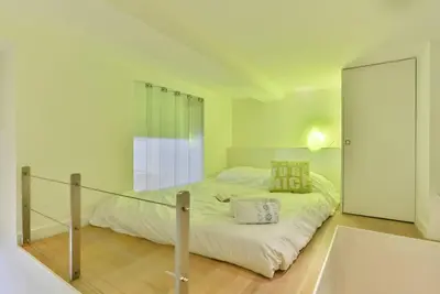 a bedroom with a large bed and a mirror at MY CASA - LIBERTÉ - Spacious Apartment City Center w AC in Nice