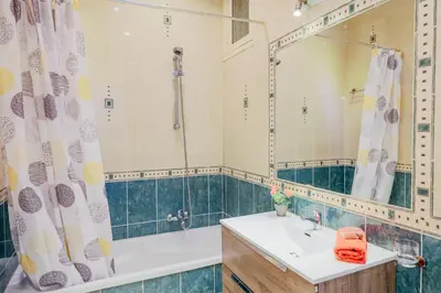 a bathroom with a tub and a sink and a shower at LE FLORIDE AP4156 Nice, by Riviera Holiday Homes in Nice