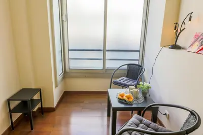 a room with a table and chairs and a window at LE FLORIDE AP4156 Nice, by Riviera Holiday Homes in Nice