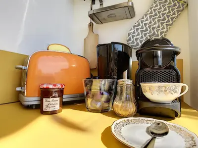a counter top with a coffee maker and other kitchen items at Nestor&Jeeves - TOUCAN DUPLEX TERRACE - Hyper center - Top floor in Nice