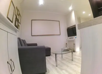 a living room with a couch and a table at Apartment in the heart of Nice in Nice