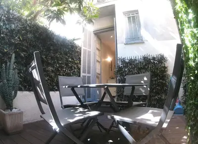 a table and two chairs sitting on a patio at Apartment in the heart of Nice in Nice