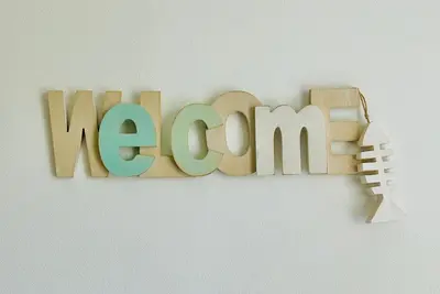 a wooden sign that says megan with a toy gun at Charmant Studio en bord de Mer in Nice
