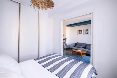 a bedroom with a bed and a couch at La Maioneta Carré d'Or in Nice