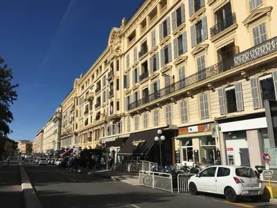 a white car parked in front of a building at Belle Epoque Studio in Nice
