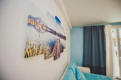a bedroom with a painting on the wall at AzurAppart 3room Nice Promenade in Nice