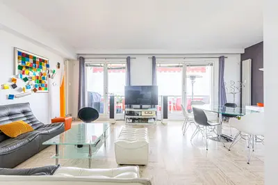 a living room with a couch and a table at Appartement Eze bord de mer in Èze