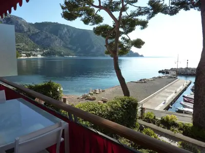 a view of the water from the balcony of a house at Appartement Eze bord de mer in Èze