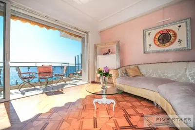 a living room with a couch and a glass table at Le Majestic Promenade - Five Stars Holiday House in Nice
