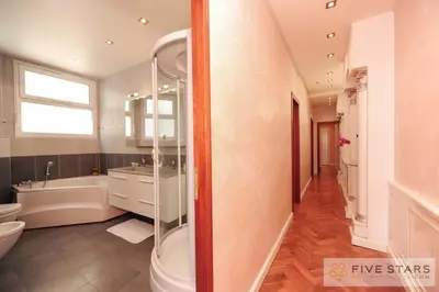 a bathroom with a tub and a sink and a toilet at Le Majestic Promenade - Five Stars Holiday House in Nice