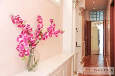 a vase filled with purple flowers sitting on a counter at Le Majestic Promenade - Five Stars Holiday House in Nice