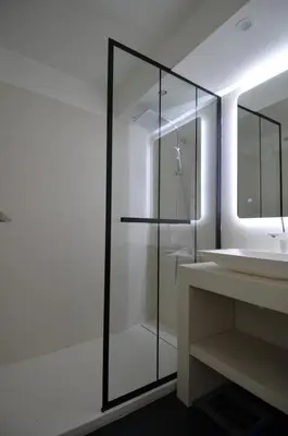 a bathroom with a glass shower and a sink at TOBIAS - Appartement Duplex 4 personnes Quartier Riquier Nice in Nice