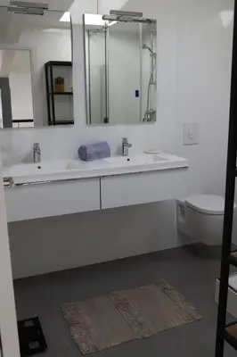 a white bathroom with a sink and a toilet at Luxueux 3 Pièces - Wilson in Nice