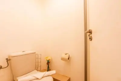 a bathroom with a toilet and a roll of toilet paper at VICTOR HUGO AP4159 Nice, by Riviera Holiday Homes in Nice