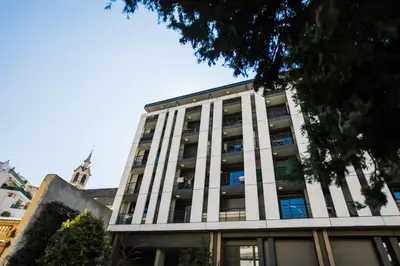 a tall white building with many windows at VICTOR HUGO AP4159 Nice, by Riviera Holiday Homes in Nice